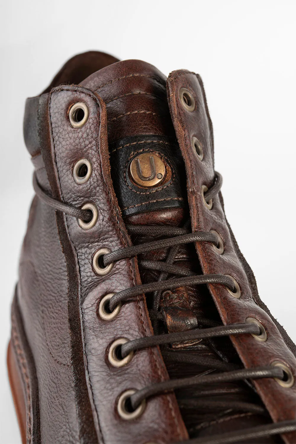 COLE cognac welted distressed high sneakers.